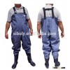 Widely applicable pvc chest high waders being used as waterproof winter work wear