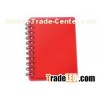 Red spiral pocket notebook with sticky notes