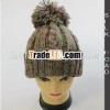 Knitted winter hat with cable effect