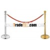 Painting black base of stanchion post for event with rope