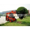 Four blade tree spade skid steer loader attachment