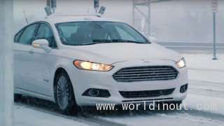 A Ford auto<em></em>nomous car driving in the snow